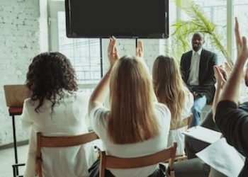 female-african-american-speaker-giving-presentation-hall-university-workshop_155003-3582
