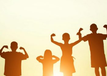 silhouette of a happy children and happy time with sunset.