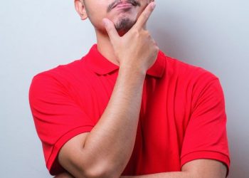 Young,Asian,Man,Wearing,Casual,Shirt,Standing,Over,White,Background